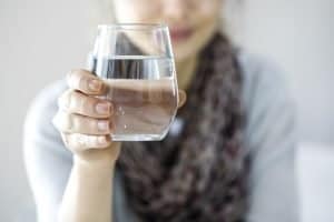 lady holding a glass of water